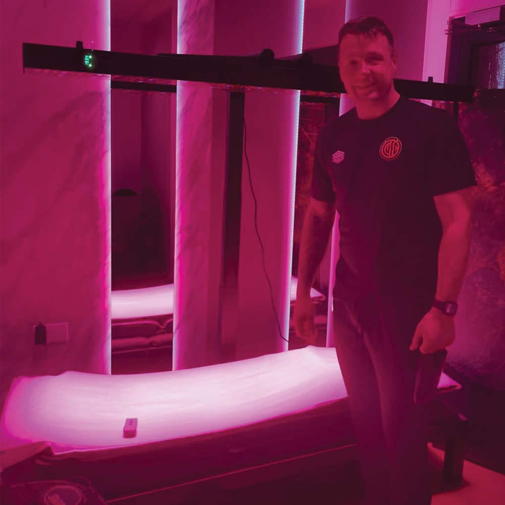 Dr Torrey Schroeder Chiropractic Centre in front of CELLER8 biohacker package