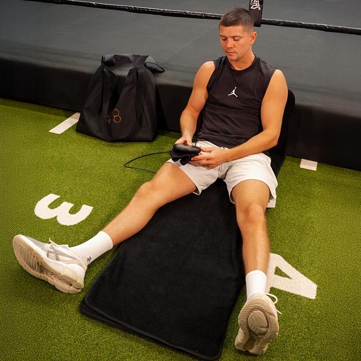 Luke Campbell sat on CELLER8 full body mat