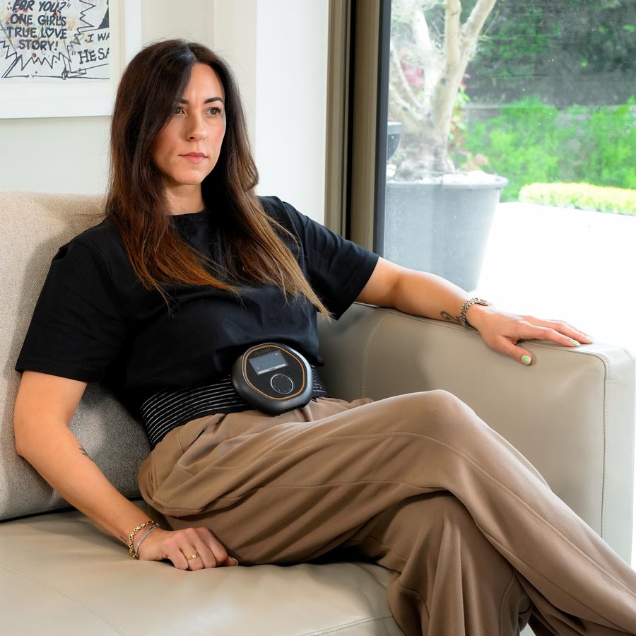 Women sat on sofa wearing CELLER8 around waist